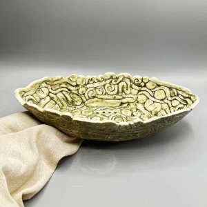 Inspired by the ancient wetlands and hidden waterways of Kauaʻi, this sculptural vessel reflects the feeling of entering a living forest where roots, stones, and water intertwine. (view 4 of 4)
