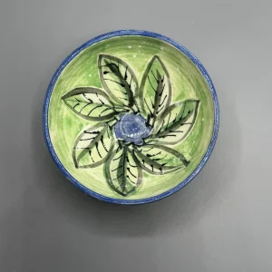 The soft green interior and deep cobalt rim give this piece a calm, reflective presence. (view 3 of 4)