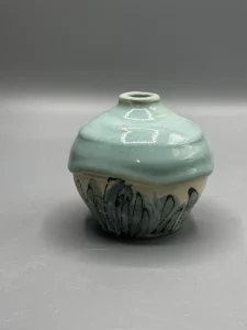 A quiet bottle form shaped around softness, rhythm, and containment.