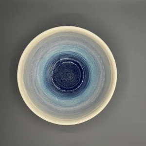 Soft bands of blue move across the surface like distant tide lines or remembered horizons. (view 2 of 4)